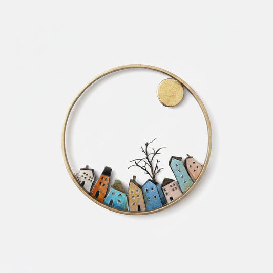 Decorative hand cut and hand painted ring with miniature houses and a tree